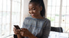 smiling girl looking at phone