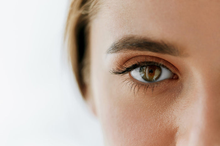 one eye looking at lense