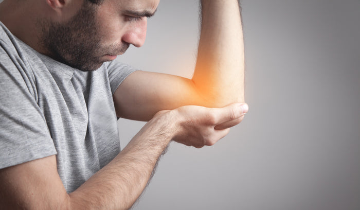 man holding is highlighted elbow