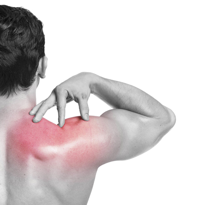 man holding his sore shoulder