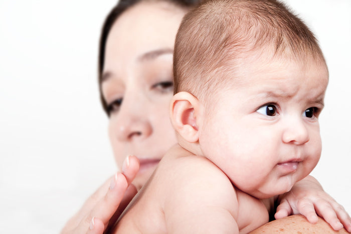mother holding a baby