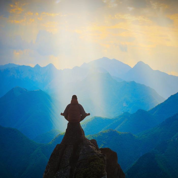 jesus figure standing on mountain