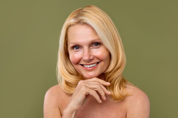 middle aged woman with glowing skin