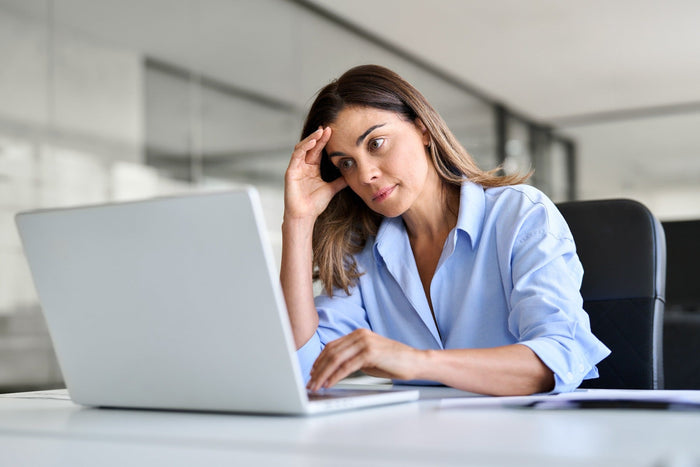 woman sitting at office and stressed