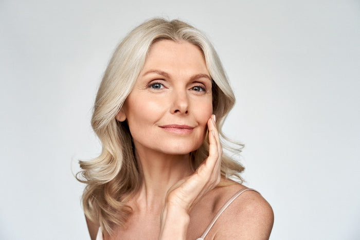 middle aged woman with glowing skin